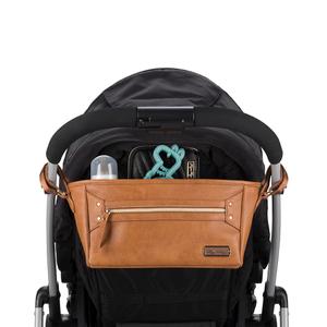 Itzy Ritzy Adjustable Stroller Caddy and Organizer Bag Featuring Front Zippered Pocket, 2 Built-in Interior Pockets & Adjustable Straps to Fit Nearly Any Stroller (Cognac)