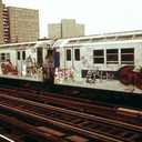 ART.COM Wall Photo A Graffiti Painted Subway Train with Housing Projects in the Background, May 1973, 18" x 12"