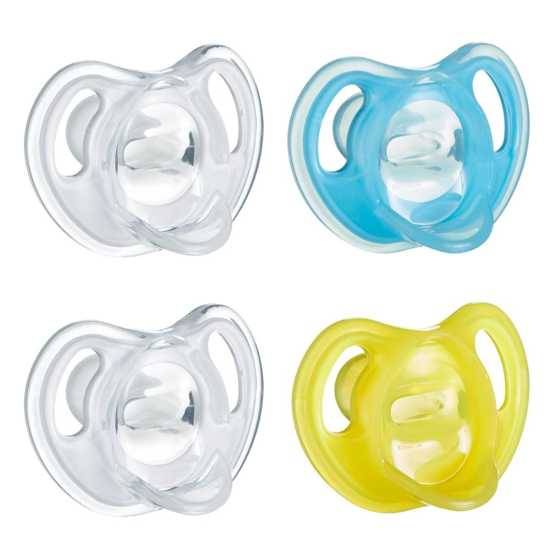 Tommee Tippee Ultra-Light Silicone Pacifier, 6-18 Months, Symmetrical One-Piece Design, BPA-Free Silicone Binkies, Clear/Blue/Yellow, Pack of 4