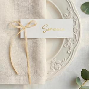 UNIQOOO 50-Pack Champagne Gold Bow Place Cards for Wedding Table Settings, Elegant Paper Name Tags for Seating Arrangement, Party Dinners, Bridal Showers, & Formal Events, 4x1.5-Inch Pre-Cut Tags