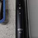Oral-B iO Deep Clean + Protect Rechargeable Electric Toothbrush, Black with a iO Series 7 Toothbrush, 2 Replacement Brush Heads, and a Charging Travel Case