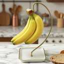 VROOMIUM Banana Holder Stand with Ceramic Base - Holds Up to 5 Pounds Bananas, Hassle-free Cleaning, Stylish and Chic Design Banana Rack - Gold