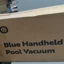 Blue handheld pool vacuum