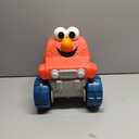 SESAME STREET Giggle N Go Monster Truck Toy Vehicle, Pops Wheelies, Sings, and Has Phrases, Kids Toys for Ages 2 Up