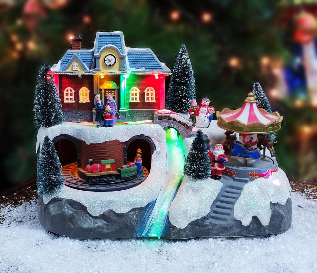 MOMENTS IN TIME Animated Musical Christmas Village 8.5H Light Up Holiday Scene with LED Lights Moving Train & Carousel Battery Operated Christmas Tabletop Decoration