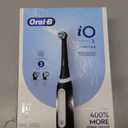 Oral-B Rechargeable Electric Toothbrush, iO3 Limited Deep Clean, 3 Cleaning Modes, Visual Pressure Sensor to Protect Gums, 2 Brush Heads, Travel Case, Black