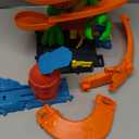 Hot Wheels Toy Car Track Set, City T-Rex Blaze Battle Playset & 1:64 Scale Die-Cast Vehicle, 18 Tall, Multiple Race Outcomes, Spinning Dinosaur Eyes