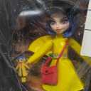 Monster High Skullector Doll, Coraline Collectible in Yellow Raincoat with Dress and Accessories Like Rag Doll, Cat Figure, and Doll Stand