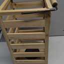 slatted wooden lantern with a black metal handle and natural finish 11"