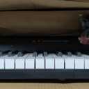 61 Key Portable Electronic Keyboard Piano w/Lighted Full Size Keys, LCD, Headphones, X-Stand, Stool, Music Rest, Microphone, Note Stickers, Built-In Speakers,3 Teaching Modes