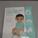 Frida Baby Fold-and-Go Portable Potty Seat for Toilet, Foldable Travel Potty Seat for Toddler, Fits Round & Oval Toilets, Non-Slip Base, Handles, Includes Free Travel Bag