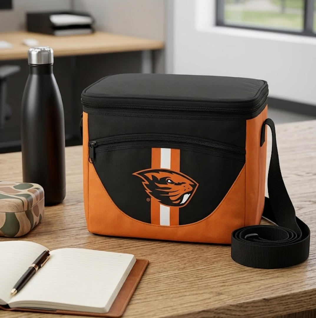 Heat sealed, leak-proof lining
Comfortable shoulder strap for easy carrying
Holds 24 cans plus ice
Additional front zipper pocket
Features sporty contrasting accents
Embroidered team logo
Includes an attached bottle opener
Dimensions: 12.25 x 8 x 12.