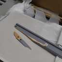 Badger Basket Sleigh-Style Baby Changing Table - Diaper Changing Station with 3 Storage Baskets - Nursery Organizer with Hamper, Changing Pad, Safety Rails - Gray