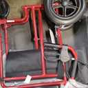 Medline Lightweight Foldable Transport Wheelchair with Handbrakes and 12-Inch Wheels, Red Frame, Black Upholstery