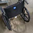 Medline Comfortable Folding Wheelchair with Swing-Back, Desk-Length Arms and Elevating Footrests, 20”W x 16”D Seat