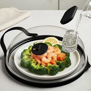 Microwave Splatter Cover with Water Steamer for Food - 10 Inch Steam Microwave Splatter Guard with Handle Plate Covers for Heating Food Splash Oven Lid with Built in Steamer , Black