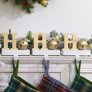 UNIQOOO Champagne Gold HoHoHo Christmas Stocking Holder Set of 3, Max 2Lb, Heavy Duty, Padded Grip Bottom, White Christmas Mantel Hooks Fireplace Garlands Wreath Decoration Hanger, w/ Bells Ribbon