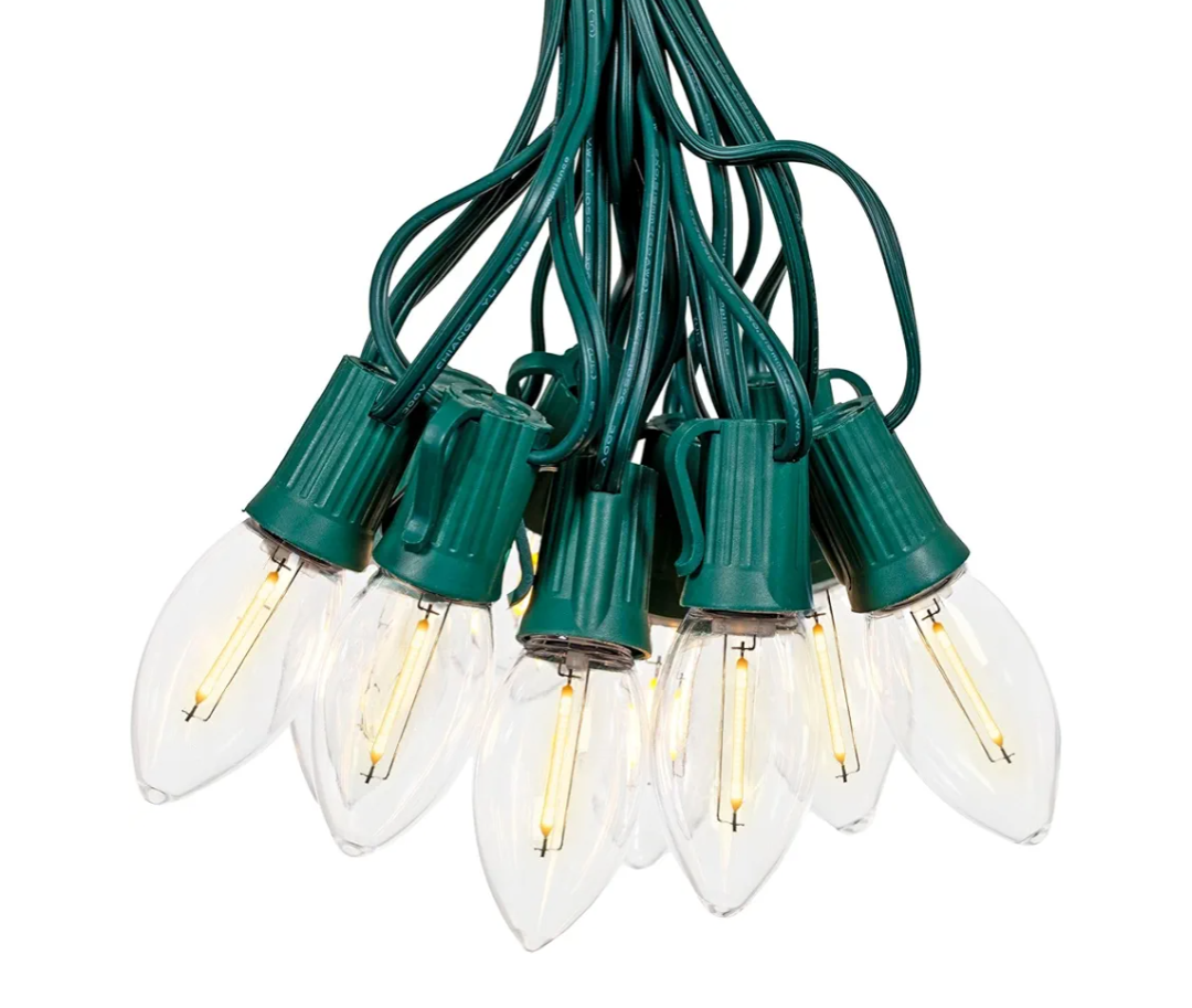 Novelty Lights 25 Ft Vintage LED C9 Warm White Transparent Christmas String Lights – 25 Shatterproof Plastic Bulbs, 12" Spacing Green Wire, Classic Filament Glow, Indoor Outdoor Holiday Lighting