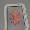 framed piece of decorative home art featuring a watercolor painting of an autumn oak leaf. 30x22 inch