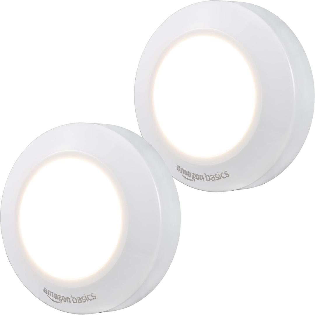 Amazon Basics LED Puck Lights, Battery Operated, 50 Lumens, Under Cabinet Lighting, Easy to Install, Easy to Use, Adhesive Backing, 2-Pack, White