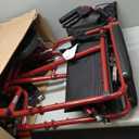Medline Lightweight Foldable Transport Wheelchair with Handbrakes and 12-Inch Wheels, Red Frame, Black Upholstery
