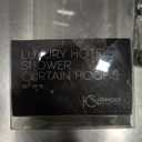 Set of 12 hotel-quality shower curtain hooks with a silver chrome finish