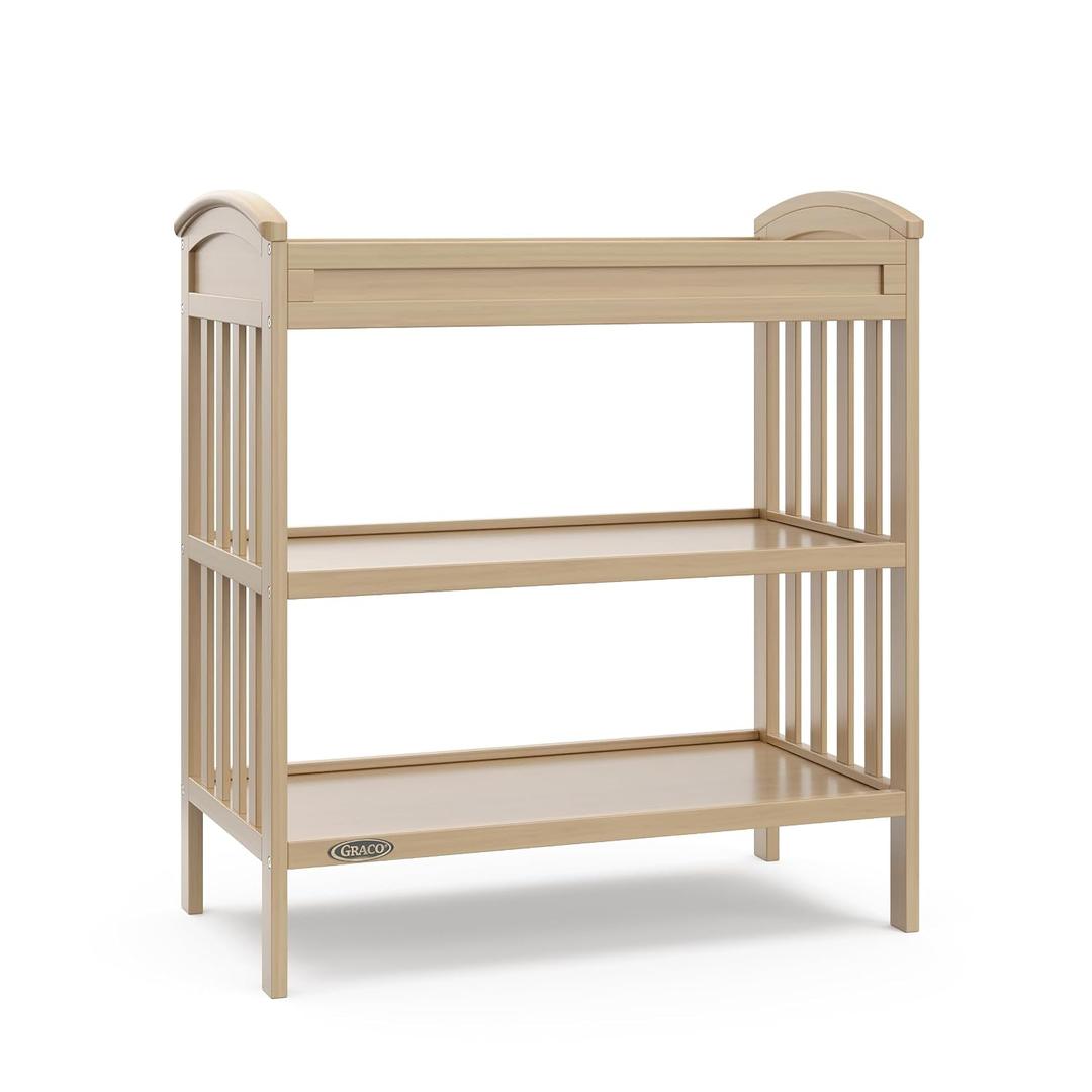Graco Benton Changing Table with Bonus Water-Resistant Changing Pad (Driftwood) - GREENGUARD Gold Certified, Includes Diaper Change Pad with Safety Strap, 2 Open Storage Shelves for Organizing