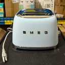 SMEG 4 Slice Toaster TSF03, Retro Stainless-Steel Toaster with Wide Slots for Bagels, 6 Browning Levels, Defrost Reheat Bagel Functions, Dual Controls, Crumb Trays, 1800W - TSF03PBUS - Pastel Blue