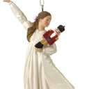 Clara Holding a Nutcracker Christmas Ornament