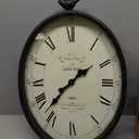 Creative Co-Op Oval Metal Wall Clock with Bird