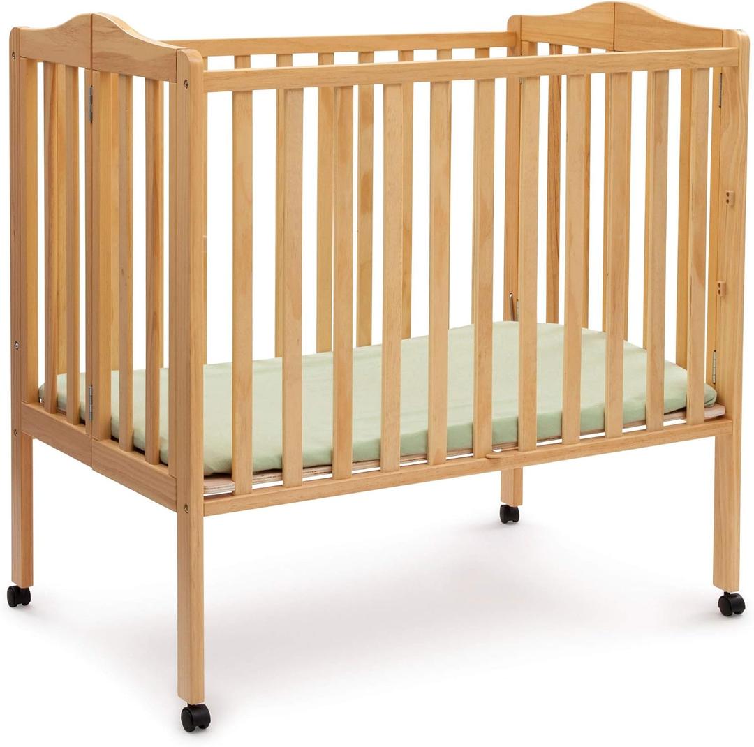 Delta Children Folding Portable Mini Baby Crib with 1.5-inch Mattress - Greenguard Gold Certified, Natural