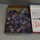 Springbok's Winter Wonderland Cafe 500 Piece Jigsaw Puzzle is a Picturesque Holiday Scene of a Cosy Cafe in The City