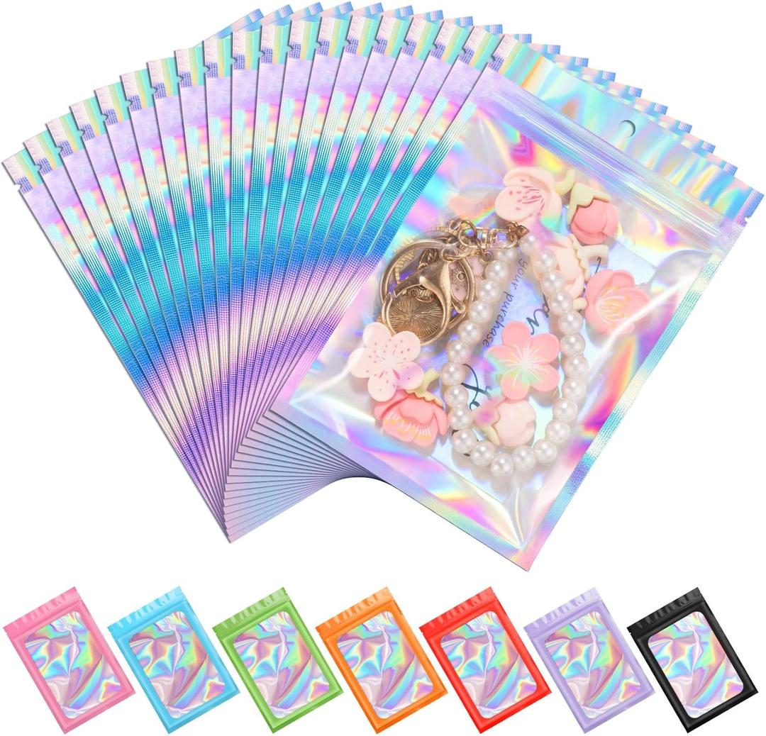 ANZNKU 100 Pack Mylar Bags Reasealable Holographic Bags, Smell Proof Bag Zipper Pouches with Clear Window, Jewelry Easter Candy Sealable Bag for Packaging Sample Party Favor (3.9 x 7.1 Inch)