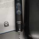 Philips Sonicare ProtectiveClean 5300 Rechargeable Electric Toothbrush, with Pressure Sensor, 3 Cleaning Modes, SmarTimer and QuadPacer, with 2 Bonus Brush Heads, Travel Case, Black, Model HX6423/34