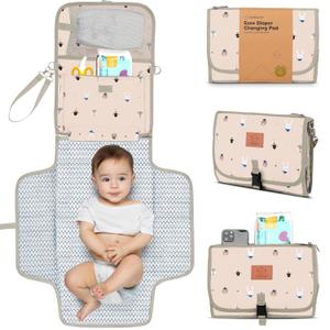 KeaBabies Portable Diaper Changing Pad - Large Waterproof Baby Changing Mat, Compact Travel Diaper Clutch, Functional Pockets Fit Newborn Essentials, Wipeable & Padded Baby Changer (Wild Patrol)