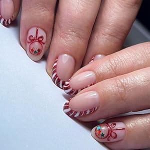 Christmas Press on Nails Red Fake Nails with Red and White Cane Design Glitter French Tip Bow Fake Nail Short Almond False Nails Winter Xmas Full Cover Christmas Acrylic Nail for Women 24 Pcs