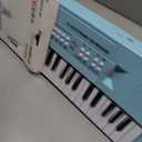 Raimy 61 Key Electric Keyboard Piano for Kids with Microphone, Compact