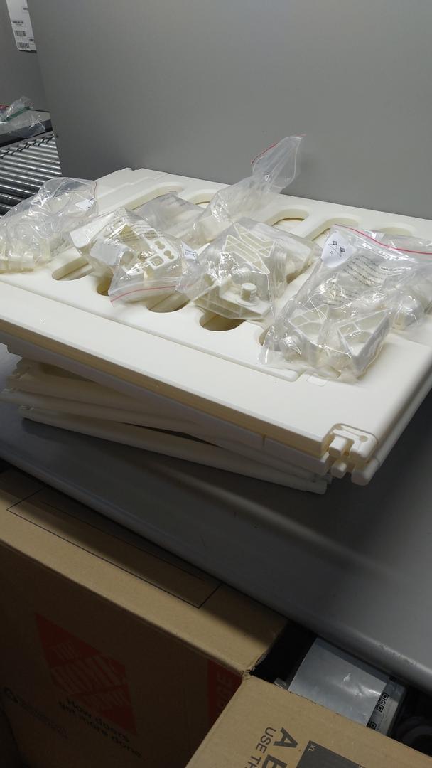 WHITE BABY CAGE ASSEMBLY KIT, WITH LOOSE PARTS.