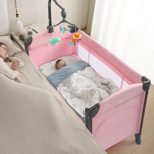 JOYMOR Baby Bedside Bassinet, Baby Bassinet, Pack n Play Convert Playpen, Quick Foldable Travel Bed, Wheels & Brake, Carry Bag for Boys Girls (Pink)