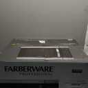 Farberware 1.1 Cu. Ft. Countertop Microwave Oven 1000 Watts Power, Auto Cook Settings, Defrost, Easy Clean and Child Safety Lock - Stainless