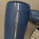 Conair Travel Hair Dryer with Dual Voltage, 1600W Compact Hairdryer with Folding Handle, Hair Blow Dryer with 2 Heat & 2 Speed Settings, Fast Drying, Frizz-Taming Airflow, Easy Storage, Blue