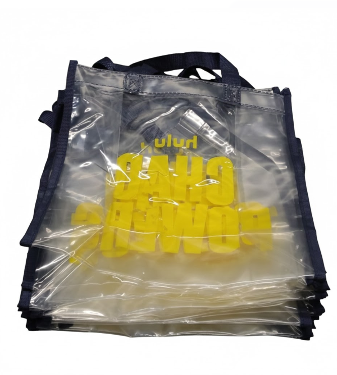 small clear tote bag, " CHAD POWERS" logo, navy blue straps, yellow logo, 10 pack