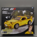 dOMOb Mazda RX-7 Yellow Initial-D 25-th Anniversary CaDA Bricks Toys for 8+ Age Kids & Adults Realistic Car Model 1:24 Simulated Build 278 Pieces or Blocks for Boys, Hobbyist, Collector