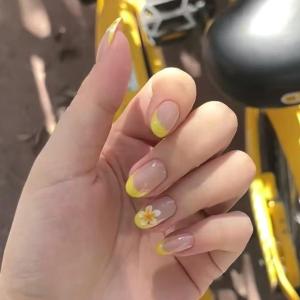 Mivota Yellow French Press on Nails with Flower Designs Short Oval Fake Nails Nude Glossy Acrylic Press in Nails Full Cover Stick on Nails for Women Nail Manicure 24 Pcs