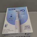 Oral-B Rechargeable Electric Toothbrush, iO3 Limited Deep Clean, 3 Cleaning Modes, Visual Pressure Sensor to Protect Gums, 2 Brush Heads, Travel Case, White