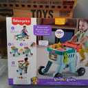 Fisher-Price Baby Push Toy 4-in-1 Snack Cart Walker Learning Activity, 14 Pieces for Pretend Play Infants Ages 6+ Months, Multilanguage Version