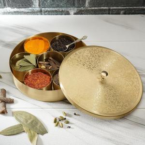 Ajuny Handcrafted Brass Round Spice Box Golden with Embossed Lid - Beautiful Design 7 Spice Containers and 1 Designer Spoon Decorative Masala Canister Organizer Gifts