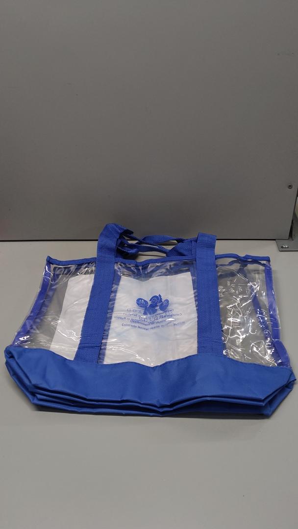 2 medium clear tote bag, blue strap, blue logo