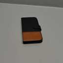 TUCCH Wallet Case for iPhone 17 (6.3") 2025, RFID Blocking 4 Card Slots, Kickstand, Shockproof TPU Shell, PU Leather, Magnetic Closure, Protective Flip Folio Cover, Black & Brown