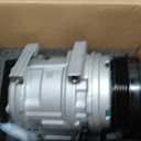 A-Premium brand automotive air conditioning compressor with an integrated clutch.